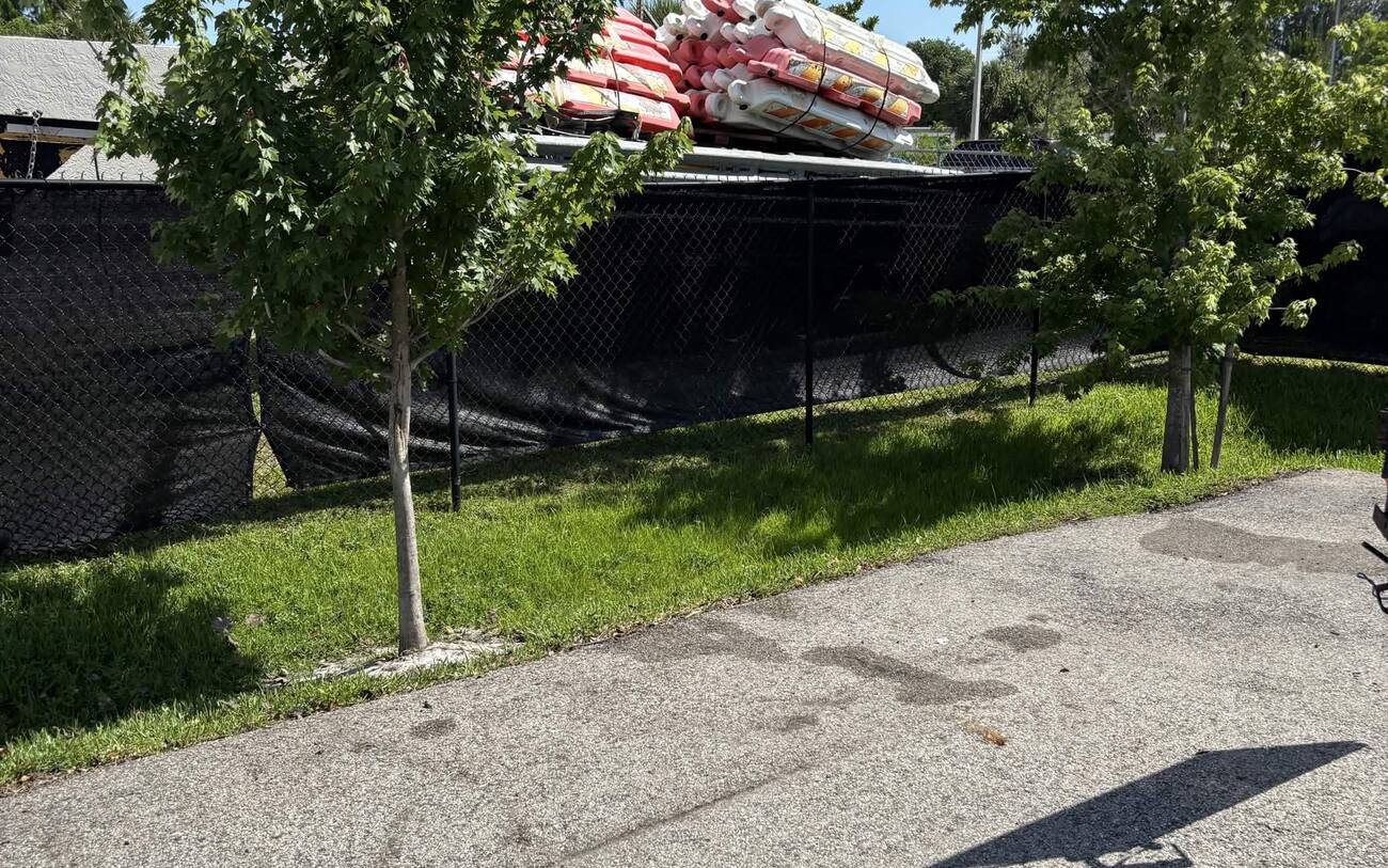 Junk removal after in Cape Coral FL — driveway cleared by J Property Services